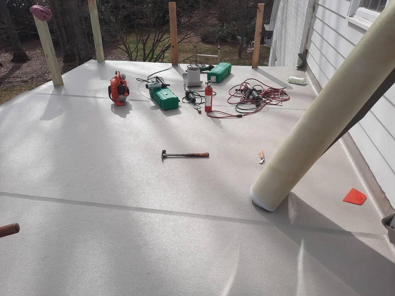 Waterproof membrane installation on a flat deck surface by J Castillo Construction