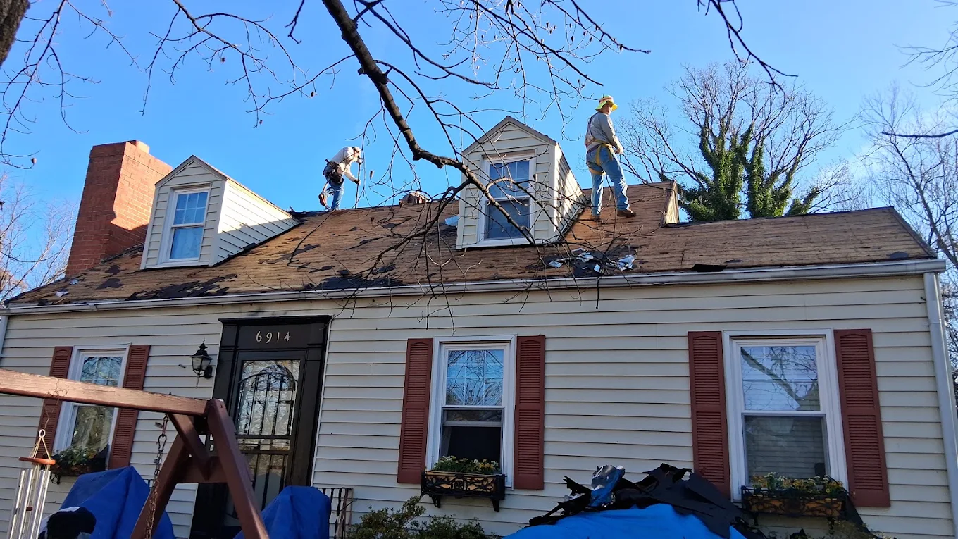 J Castillo Construction roofing crew replacing a residential roof in Herndon, VA